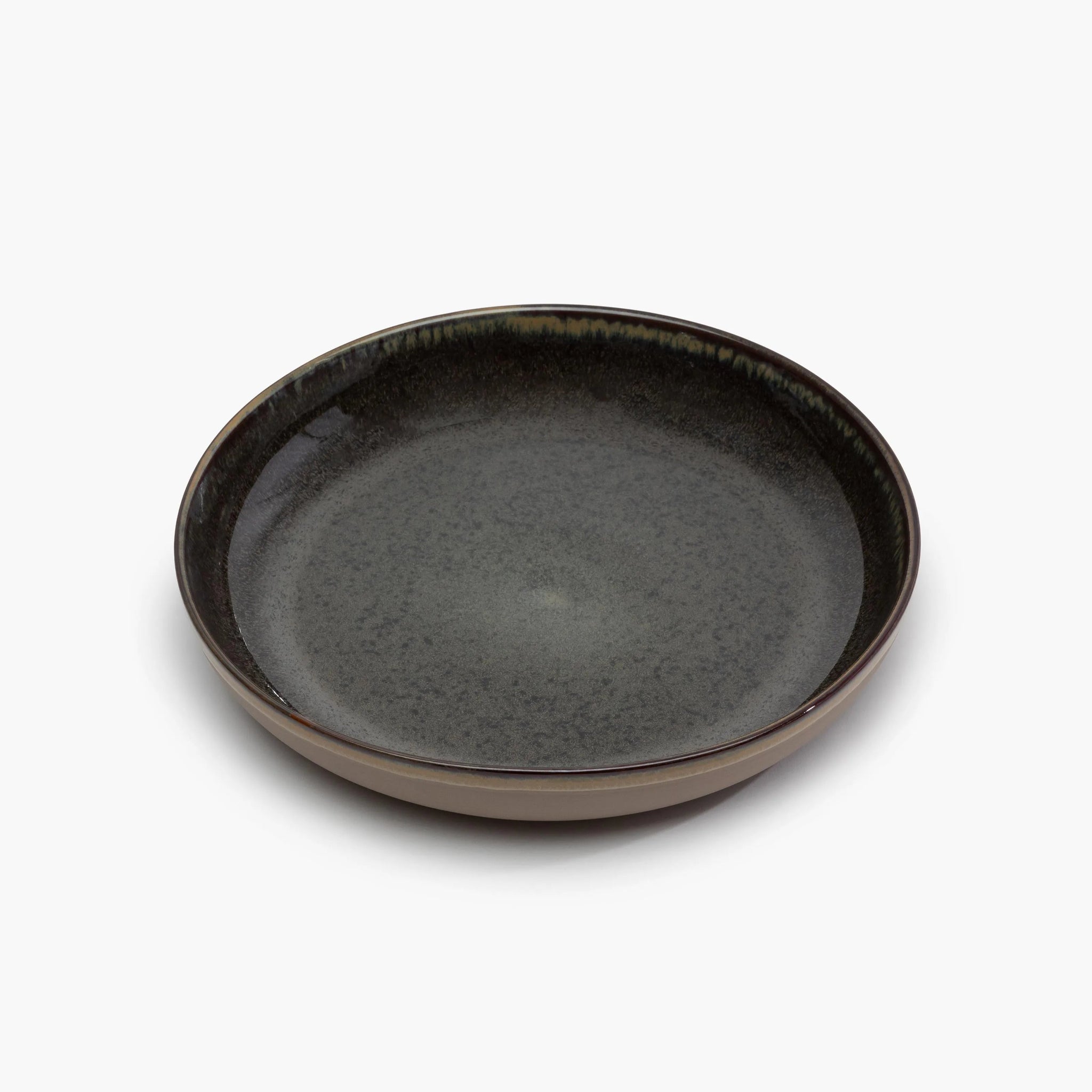 Dark gray ceramic plate on a white background