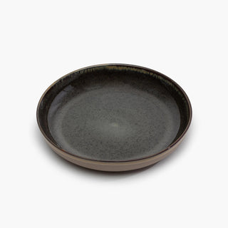 Dark gray ceramic plate on a white background