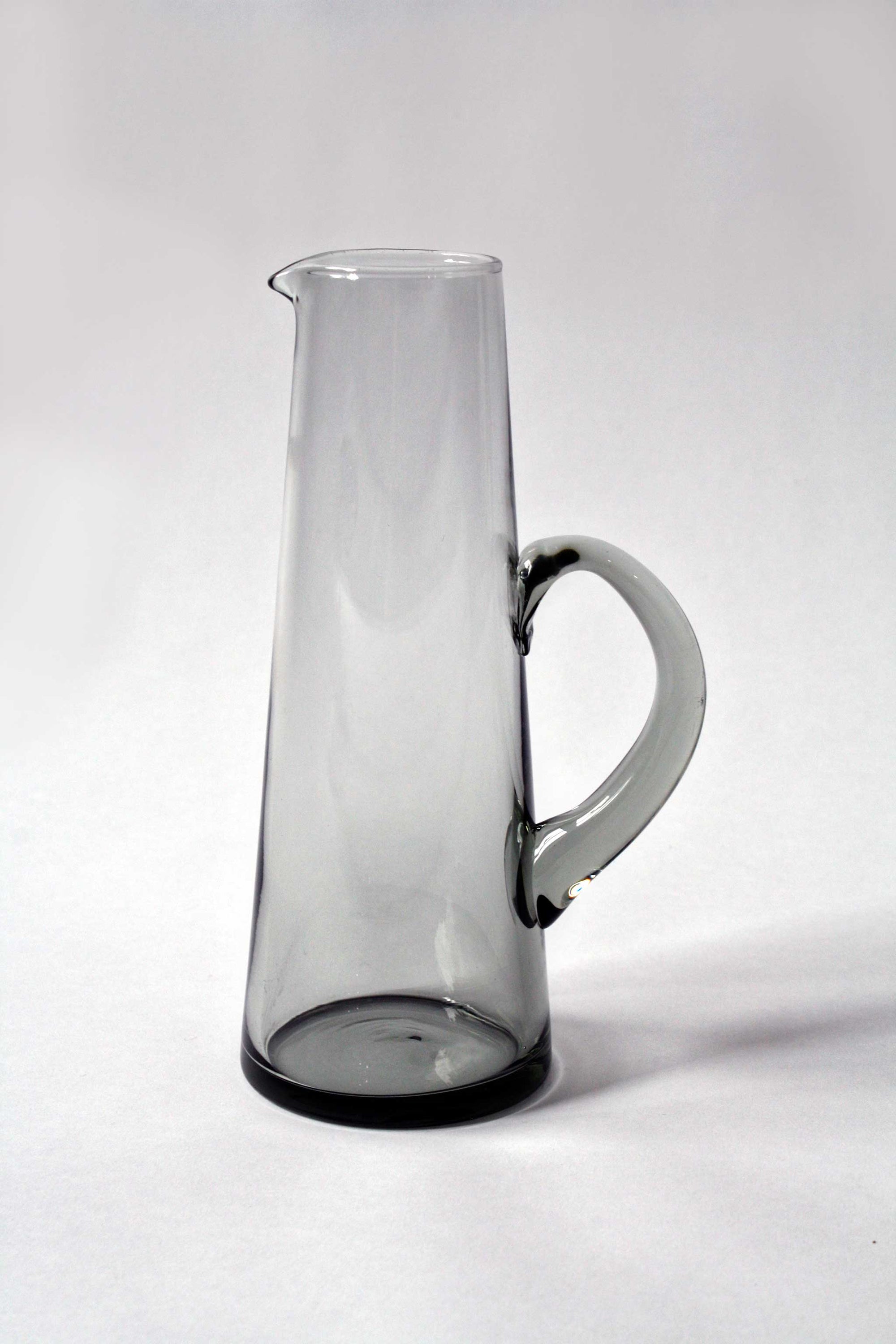https://elysian-collective.com/cdn/shop/products/Elysian-Collective_vintage-mid-century-smoke-glass-pitcher_2000x.jpg?v=1667488296