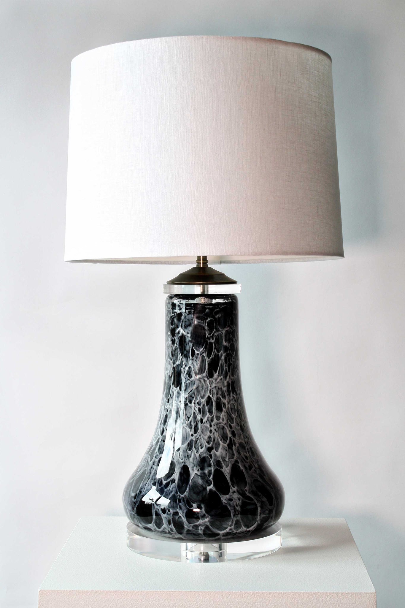 black and white blown glass table lamp with linen shade