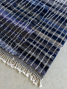 Dark blue patterned area rug made in thick sheep’s wool from New Zealand, hand woven by the women of the Beni M’rirt tribe of Morocco