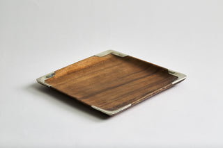 Square shaped Ibera decorative trays hand-carved made of acacia wood in Argentina with curved edges accented with Alpaca silver metal trim