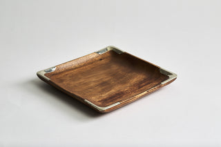 Square shaped Ibera decorative trays hand-carved made of acacia wood in Argentina with curved edges accented with Alpaca silver metal trim