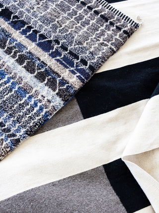Nima wool flat-weave area rug contemporary black grey white stripe design hand woven Zapotec Mexico