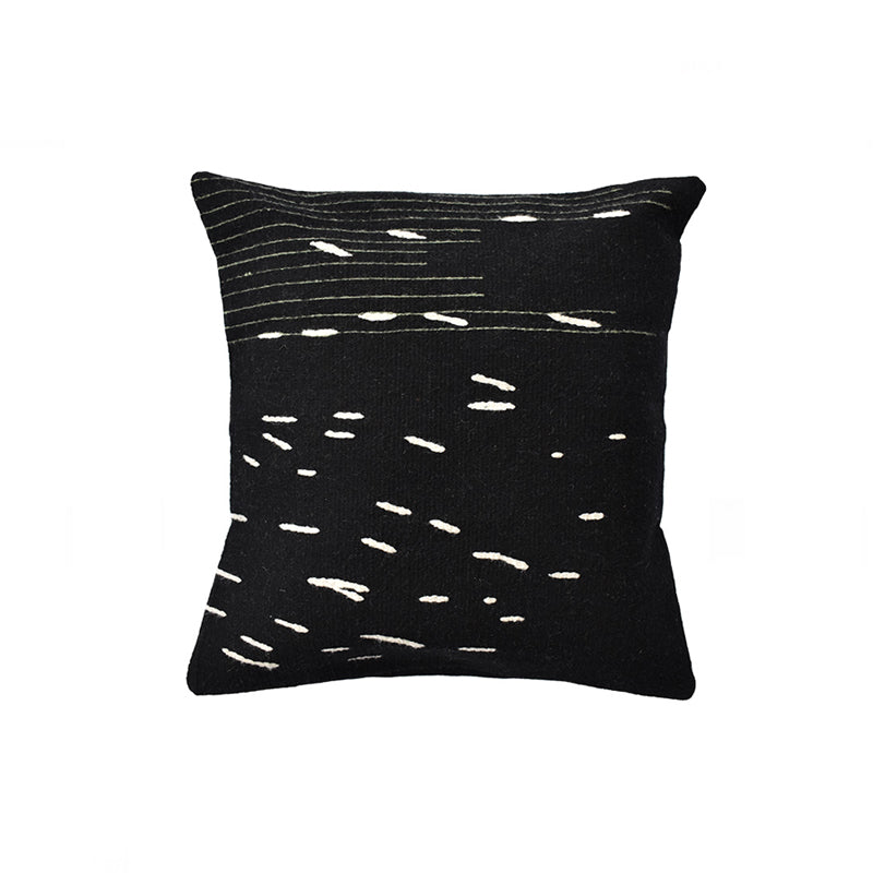Domos square wool throw pillow in a contemporary organic black and white pattern hand-woven on a pedal loom in Oaxaca, Mexico