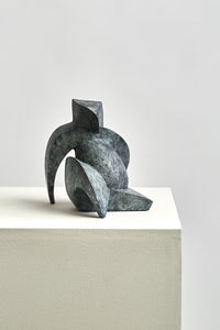 Latona bronze sculptural art form sitting on pedestal features curves contrasting with sharp corners