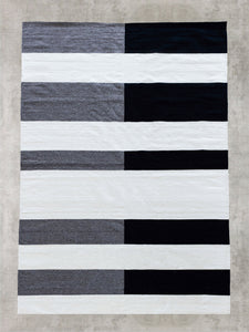 Nima wool flat-weave area rug contemporary black grey white stripe design hand woven Zapotec Mexico